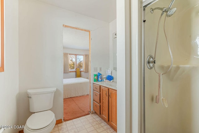 bathroom featuring walk in shower, tile flooring, toilet, and vanity