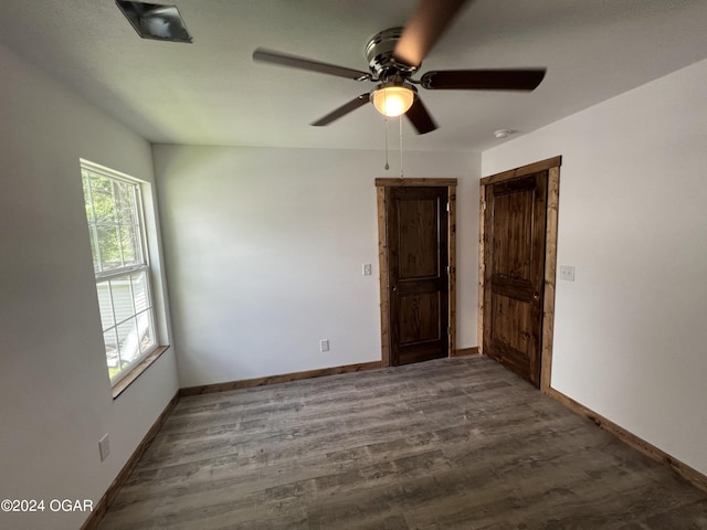 empty room with dark wood-type flooring