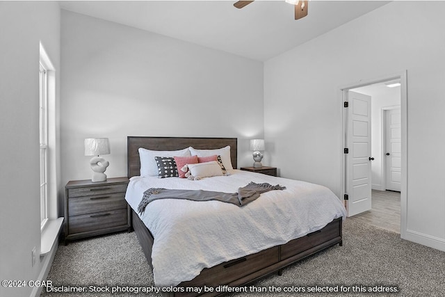 bedroom with ceiling fan, carpet, and lofted ceiling