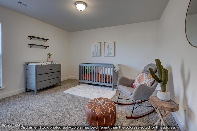 bedroom with light colored carpet and a crib