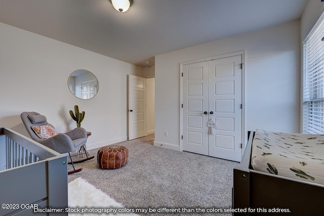 carpeted bedroom featuring a closet