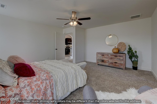 bedroom with light carpet and ceiling fan