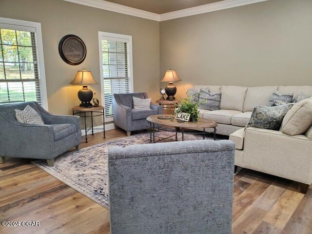 21942 Mill Creek Cir, Shell Knob, MO 65747 - living room with a healthy amount of sunlight, crown molding, and hardwood / wood-style floors