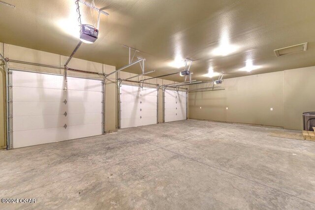21942 Mill Creek Cir, Shell Knob, MO 65747 - garage featuring a garage door opener