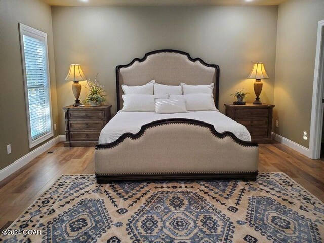 21942 Mill Creek Cir, Shell Knob, MO 65747 - bedroom with hardwood / wood-style flooring
