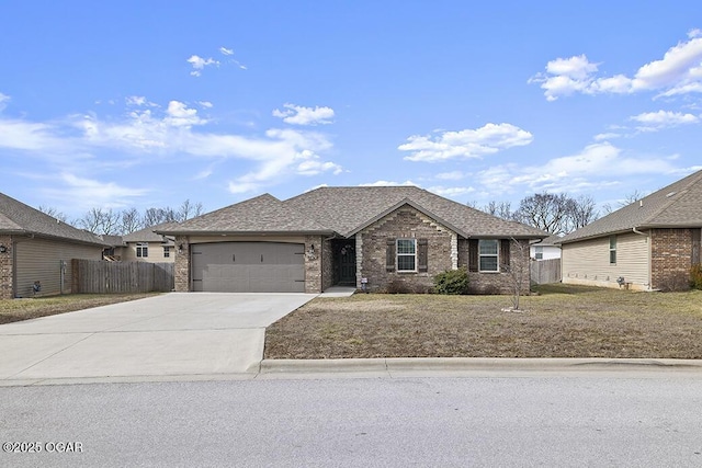 ranch-style home with a garage and a front lawn