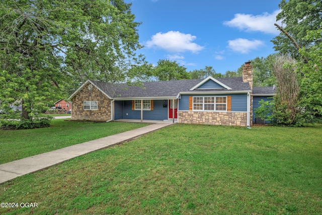 ranch-style house featuring a front lawn