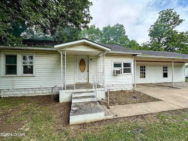 view of front of property featuring cooling unit