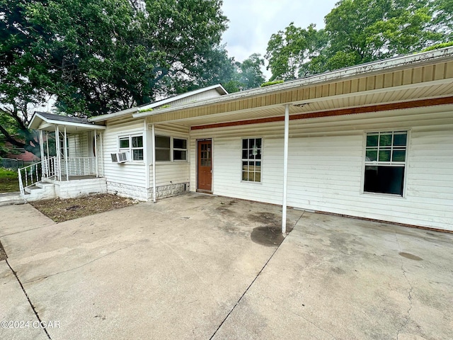 back of property featuring cooling unit