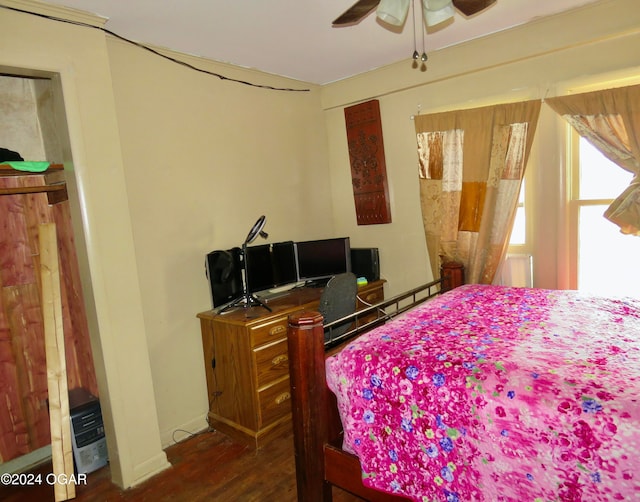 bedroom featuring ceiling fan and dark hardwood / wood-style flooring