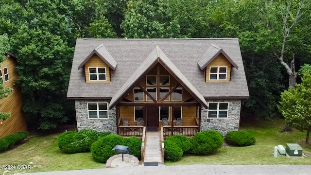 view of front of house featuring a front lawn and covered porch