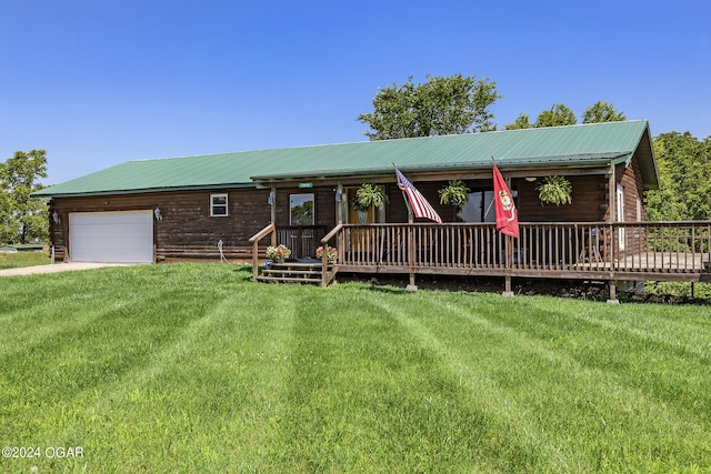 view of front facade with a front yard and a garage