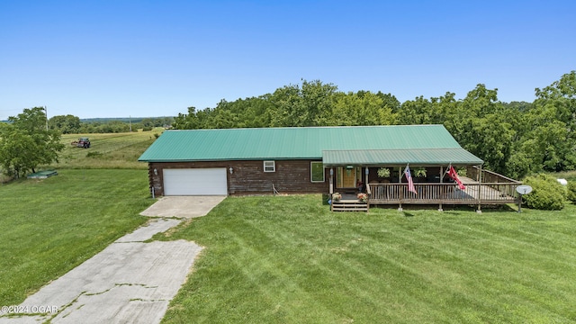 view of front of house with a front lawn and a garage