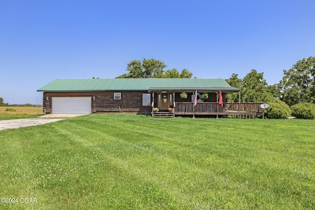 view of front of home with a front yard and a deck