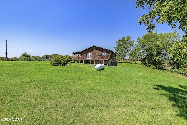 view of yard featuring a wooden deck