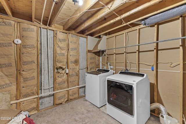 laundry area with washing machine and clothes dryer