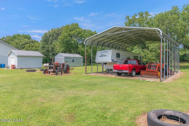 view of yard with a storage shed and a carport