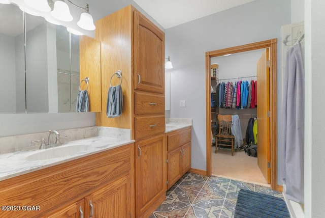 bathroom with vanity and tile patterned floors