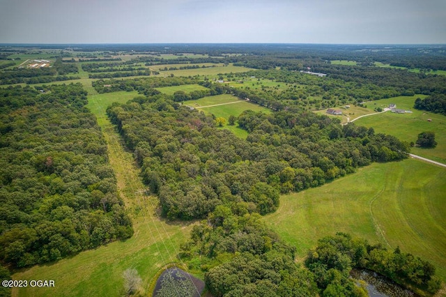 birds eye view of property with a rural view