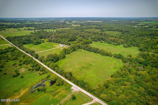 birds eye view of property featuring a rural view