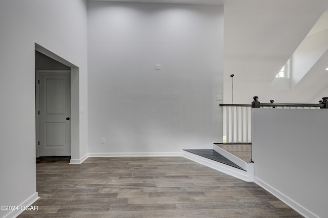 interior space with hardwood / wood-style flooring and a barn door