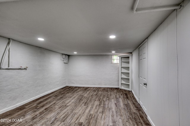 basement featuring wood-type flooring