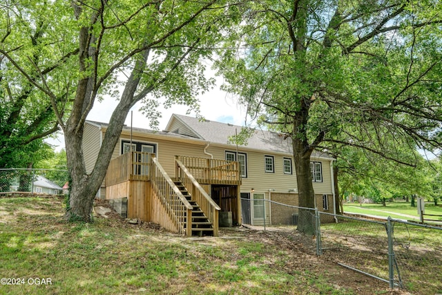 back of property featuring a deck