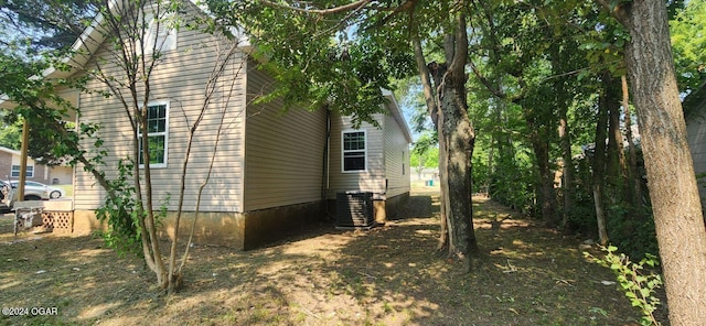 view of side of property with central AC unit