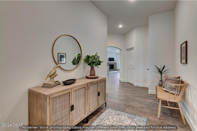 corridor with hardwood / wood-style flooring