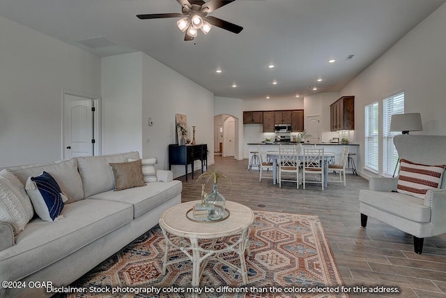 living room with ceiling fan and hardwood / wood-style floors