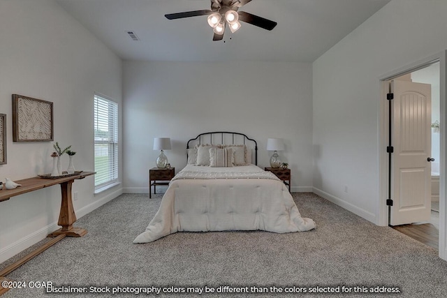 bedroom featuring ceiling fan and light colored carpet