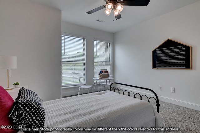 bedroom with ceiling fan and carpet