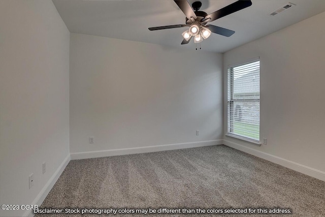 carpeted spare room with ceiling fan