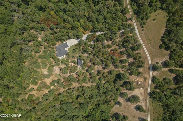 7221 State Highway 90, Pineville, MO 64856 - birds eye view of property featuring a wooded view