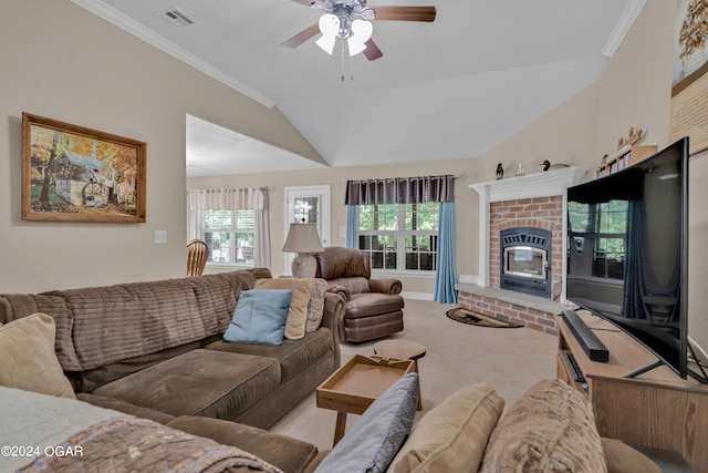 carpeted living room featuring ceiling fan, crown molding, lofted ceiling, and a brick fireplace