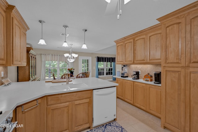 kitchen featuring backsplash, pendant lighting, dishwasher, light tile patterned floors, and sink