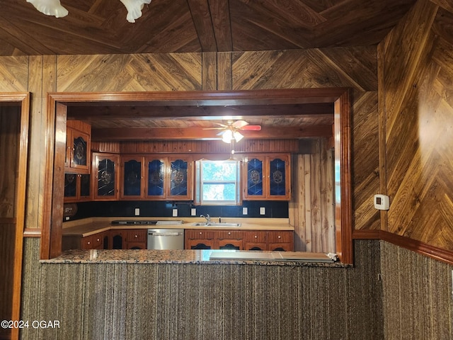 bar with sink, stainless steel dishwasher, and ceiling fan