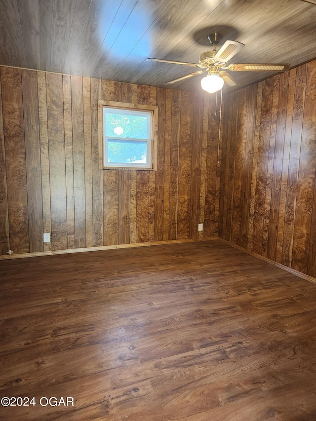 unfurnished room featuring wooden ceiling, dark hardwood / wood-style floors, and ceiling fan