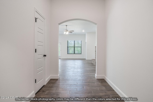 hallway with dark hardwood / wood-style floors