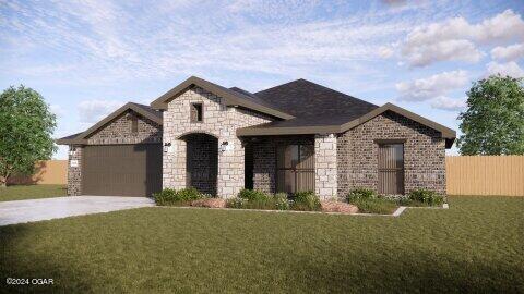 view of front facade featuring a garage and a front lawn