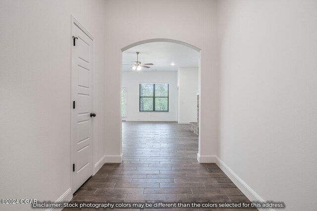 hallway with dark wood-type flooring