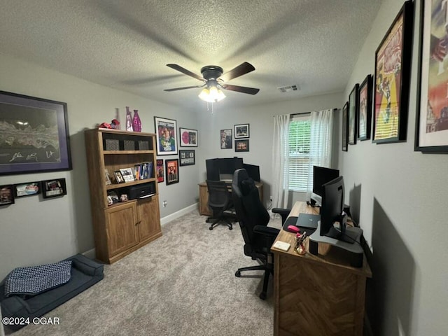 office with light carpet, a textured ceiling, and ceiling fan