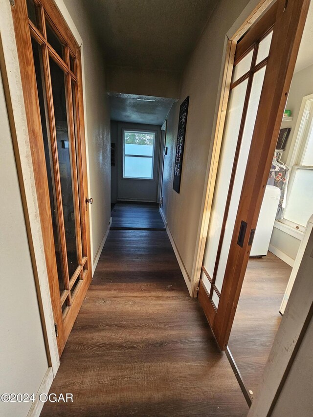 hallway featuring dark hardwood / wood-style flooring