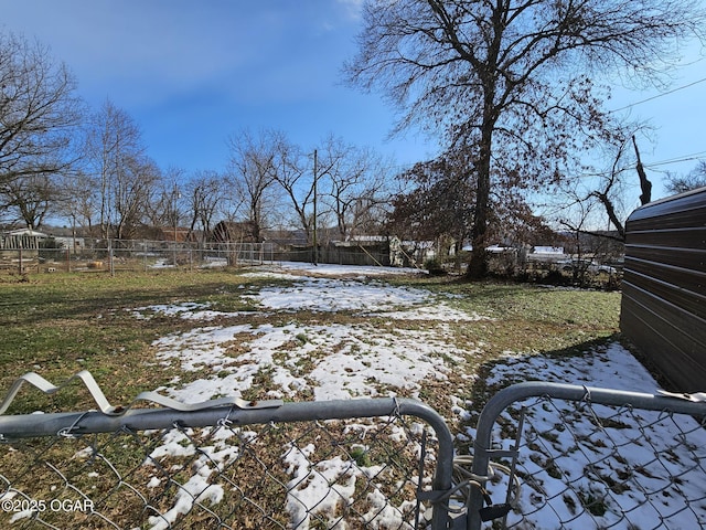 view of yard layered in snow