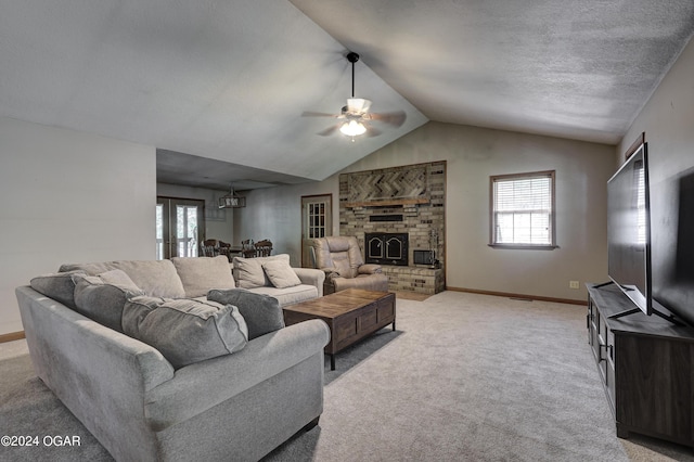 living area with plenty of natural light, baseboards, a fireplace with raised hearth, and light colored carpet