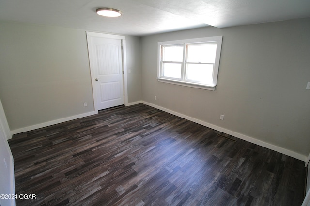 empty room with wood-type flooring