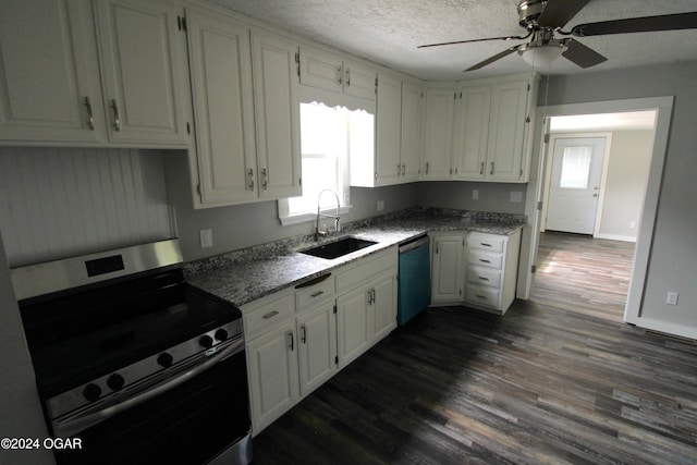 kitchen with appliances with stainless steel finishes, white cabinets, dark hardwood / wood-style floors, and sink