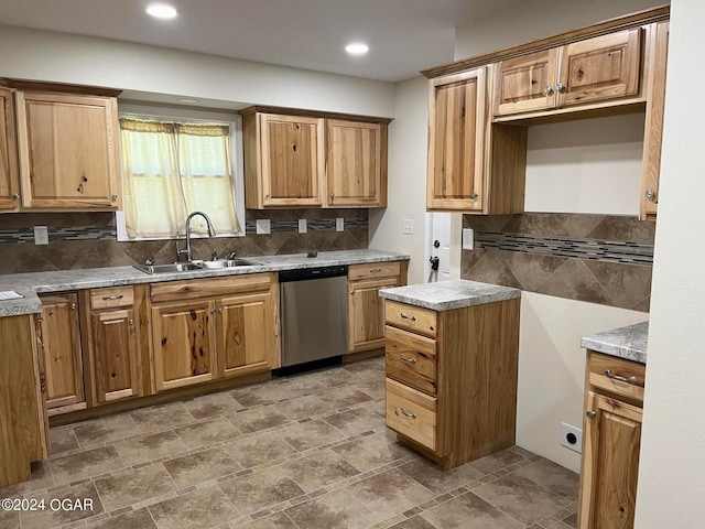 kitchen with stainless steel dishwasher, sink, tile patterned floors, and backsplash