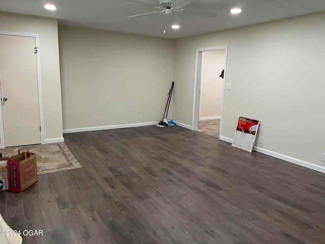 empty room featuring ceiling fan and dark hardwood / wood-style flooring