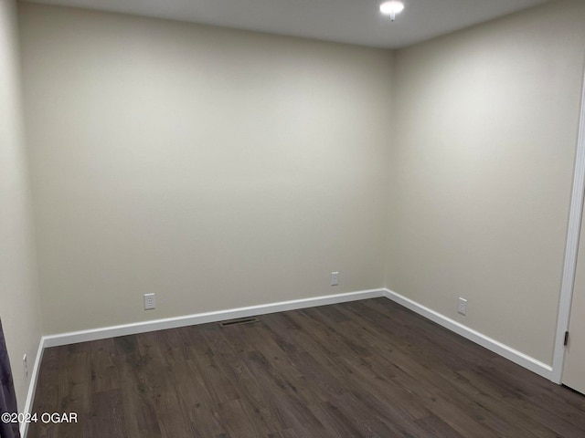 spare room with hardwood / wood-style flooring